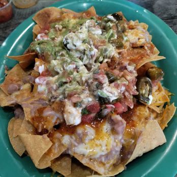 Chilitos Mexican Grill - Carne Asada Nachos. I already mixed up the toppings before taking the picture. So amazingly scrumptious and a very large serving! - Mexican Near Me - Riverside, California Chilitos Mexican Grill - Carne Asada Nachos. I already mixed up the toppings before taking the picture. So amazingly scrumptious and a very large serving! - Mexican Near Me - Riverside, California