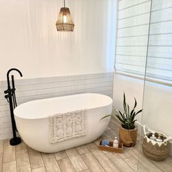 JRP Construction - Moved plumbing for new freestanding tub, Schlutter waterproofing under all floors.