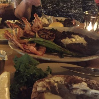 Ishnala - This was their steak and prawns dinner for two. Absolutely delicious!  It came with grilled asparagus, potato of your choice and salad. - Steakhouses Near Me - Wisconsin Dells, Wisconsin