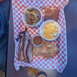 My dinner that included a breaded pork chop, brisket, candied yams, mac & cheese, and cornbread.  Everything was amazing!