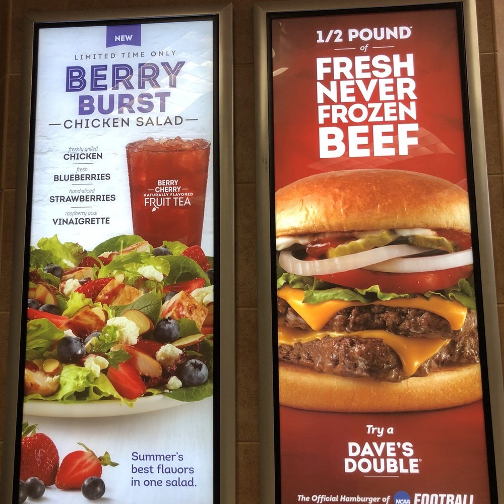 Wendy's - two posters of a burger and a salad - Fast Food Near Me - Longmont, Colorado