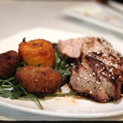Oaxacan Pork Tenderloin ($27) - classic mole, twice cooked plantain, sesame