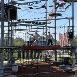 SOAR Adventure Tower - Us walking across a suspended canoe