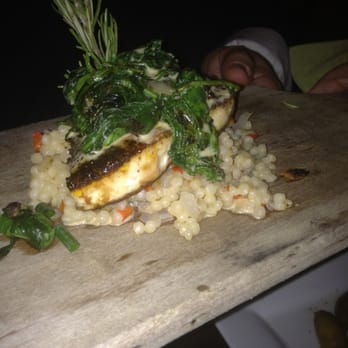 Petit Bistro - Blackened swordfish over Israeli cous cous - French Near Me - Bentonville, Arkansas Petit Bistro - Blackened swordfish over Israeli cous cous - French Near Me - Bentonville, Arkansas