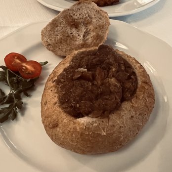 Restauracja Pod Herbami - Cabbage stewed with meat and sausage in a bread bowl - Polish Near Me - Warsaw, MZ Restauracja Pod Herbami - Cabbage stewed with meat and sausage in a bread bowl - Polish Near Me - Warsaw, MZ