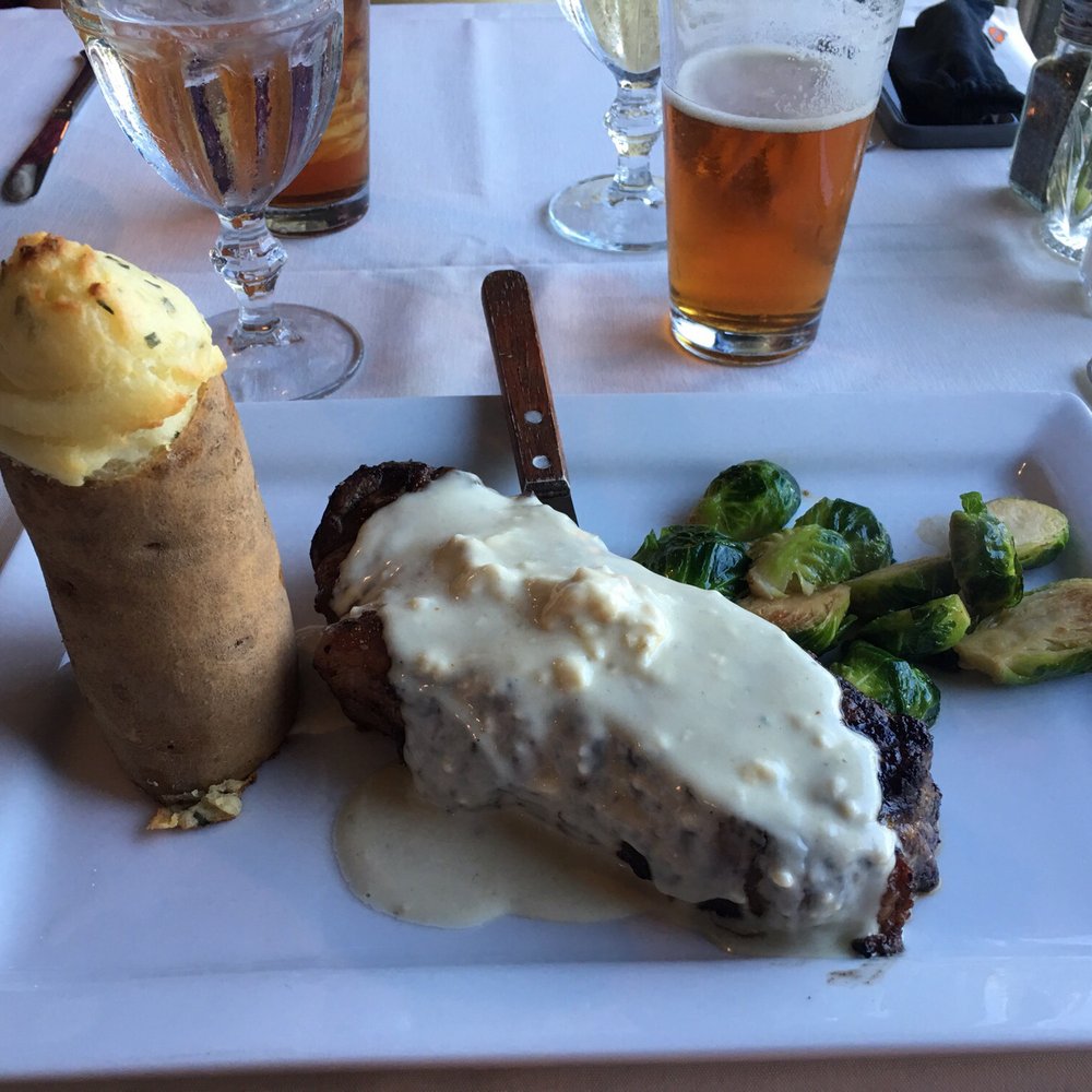 Haven 55 - Strip Steak blue cheese sauce. Baked potato and Brussel sprouts. - American Near Me - Pineville, Missouri Haven 55 - Strip Steak blue cheese sauce. Baked potato and Brussel sprouts. - American Near Me - Pineville, Missouri