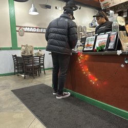 Wingstop - They shorted this customer a bunch of wings. He had to explain it to two employees.