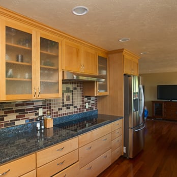 Moir Construction - a kitchen with wood cabinets and granite countertops - General Contractors Near Me - Eugene, Oregon Moir Construction - a kitchen with wood cabinets and granite countertops - General Contractors Near Me - Eugene, Oregon