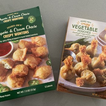 Trader Joe's - Jalapeño & Cream Cheese crispy wontons, and Crispy Vegetable Pouches - Two Trader Joe's frozen snack boxes are shown: one with jalapeño and cream cheese crispy wontons, and another with vegetable pouches filled with savory ingredients. - Grocery Near Me - Concord, California