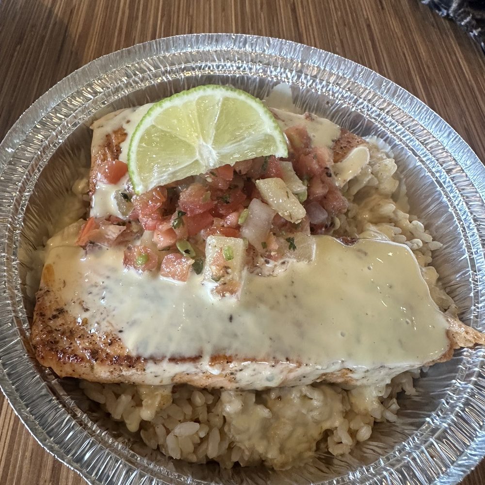 Blackened salmon enter with mango salsa and brown rice. Blackened salmon enter with mango salsa and brown rice.