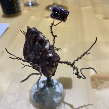 Nook - Chocolate bark with elderberry gelatin served in a tree. - New American Near Me - Madison, Wisconsin