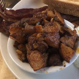 Over cooked potatoes and bacon. Over cooked potatoes and bacon.