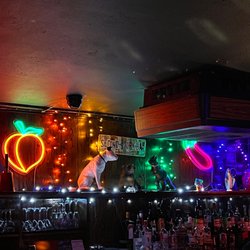 Second Story Bar - Fabulous emoji neon signs above the bar