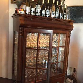 Organized Crime Winery - a display case full of wine bottles - Wineries Near Me - Beamsville, Ontario Organized Crime Winery - a display case full of wine bottles - Wineries Near Me - Beamsville, Ontario
