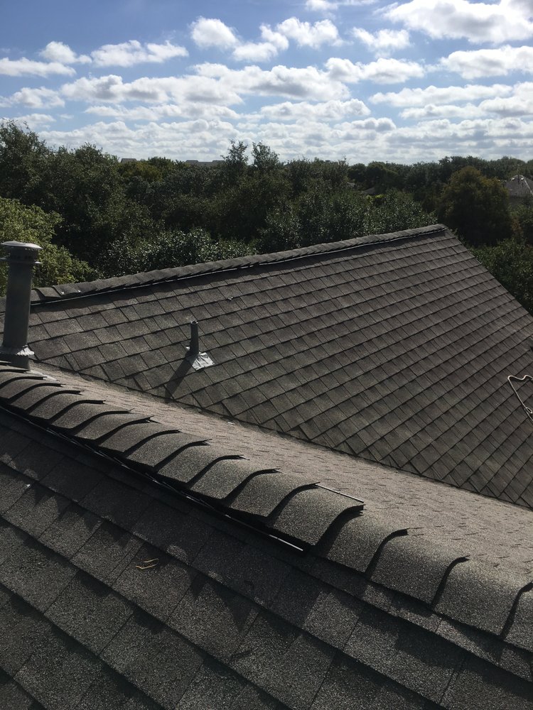 Slide of Rey's roofing and contractors