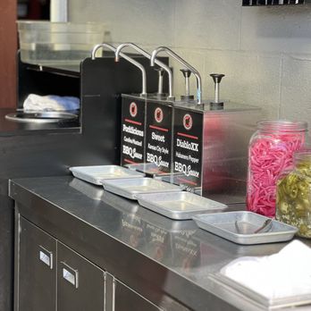 Capelo's Barbecue - Another one of their sauces station - Barbeque Near Me - Redwood City, California Capelo's Barbecue - Another one of their sauces station - Barbeque Near Me - Redwood City, California
