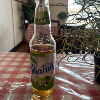 Caribbean Cuisine - Carib Shandy Lime flavored (alcoholic drink) - Caribbean Near Me - Glendale, Arizona