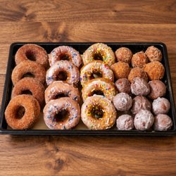 Sweet Crimes - Donuts & Donut Holes Platter

A platter of apple cider donuts and donut holes, perfect for any occasion.