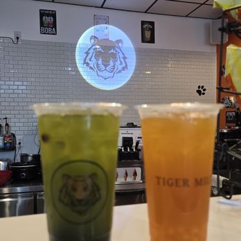 Tiger Milk - Kiwi fruit tea with regular Boba and mango fruit tea with mango popping bubble. - Bubble Tea Near Me - Goldsboro, North Carolina Tiger Milk - Kiwi fruit tea with regular Boba and mango fruit tea with mango popping bubble. - Bubble Tea Near Me - Goldsboro, North Carolina