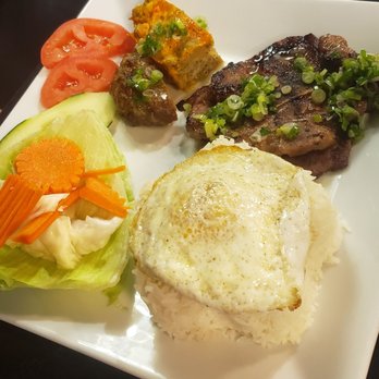 Pho U Vietnamese Cuisine - Com tam thit nuong grilled pork with rice, pickled veggies, and a over easy egg - Vietnamese Near Me - Alexandria, Louisiana Pho U Vietnamese Cuisine - Com tam thit nuong grilled pork with rice, pickled veggies, and a over easy egg - Vietnamese Near Me - Alexandria, Louisiana