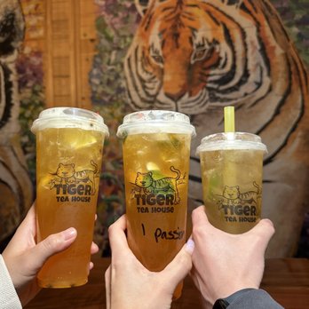 Tiger Tea House - two people toasting their drinks - Bubble Tea Near Me - Hanford, California Tiger Tea House - two people toasting their drinks - Bubble Tea Near Me - Hanford, California