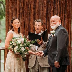 Carrie Mayfield Photography - Wedding ceremony. Bride and Groom looking at their family.