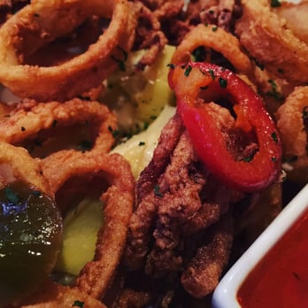 Sitting Duck Tavern - Calamari with pickled pepper and artichoke hearts. Tomato sauce too! - New American Near Me - Stratford, Connecticut Sitting Duck Tavern - Calamari with pickled pepper and artichoke hearts. Tomato sauce too! - New American Near Me - Stratford, Connecticut