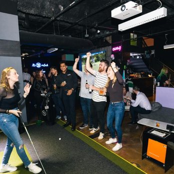 Five Iron Golf - a group of people playing a game - Venues & Event Spaces Near Me - Indianapolis, Indiana Five Iron Golf - a group of people playing a game - Venues & Event Spaces Near Me - Indianapolis, Indiana