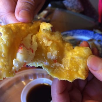 Chong's Dumpling House - Crab Rangoon. There's a bite taken out, so this is only half the triangle, but you can see the extreme lack of filling in them. - Chinese Near Me - Lansdale, Pennsylvania Chong's Dumpling House - Crab Rangoon. There's a bite taken out, so this is only half the triangle, but you can see the extreme lack of filling in them. - Chinese Near Me - Lansdale, Pennsylvania