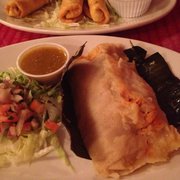 Photo of Alebrijes Mexican Delicacies - Kingston, NY, United States. Taquitos in the background (my husband couldn't wait) and the tamale