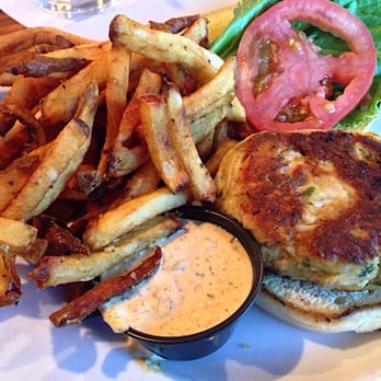 Blue Moon Beach Grill - Crab cake sandwich (broiled) with fries and remoulade on the side - Seafood Near Me - Nags Head, North Carolina Blue Moon Beach Grill - Crab cake sandwich (broiled) with fries and remoulade on the side - Seafood Near Me - Nags Head, North Carolina