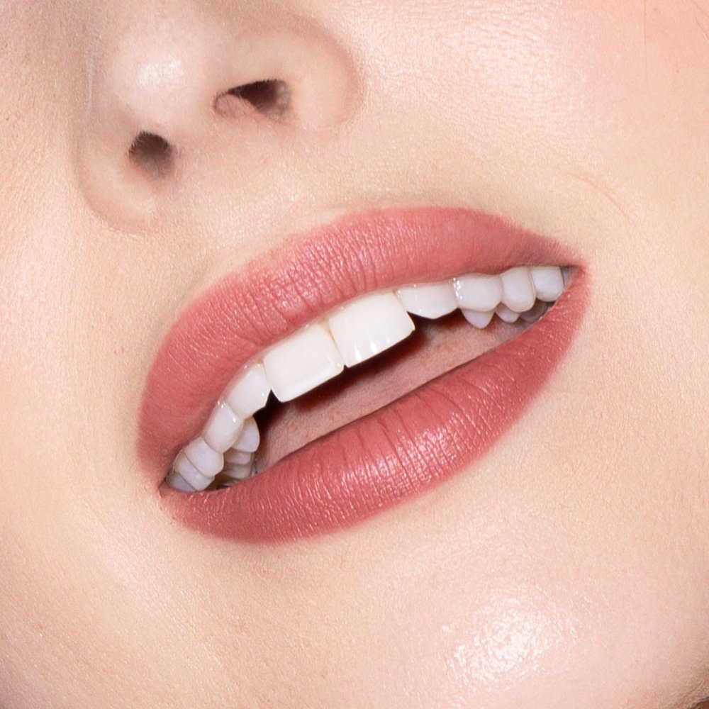Merle Norman Cosmetic Studios Logo