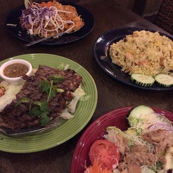 Tracy Thai Restaurant - Chicken salad, screaming tiger (grilled ribeye sliced), combo pad thai and pineapple fried rice - Thai Near Me - Tracy, California
