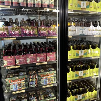 Bell's General Store - Bell's General Store - A glass-front refrigerated display case showcases a selection of craft beers, including bottles and cans, with colorful labels and packaging. - Beer, Wine & Spirits Near Me - Kalamazoo, Michigan
