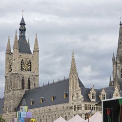 Lakenhal - The Cloth Hall Belfy (Left) and the taller spire of St. Martin's Cathedral (Right) behind it