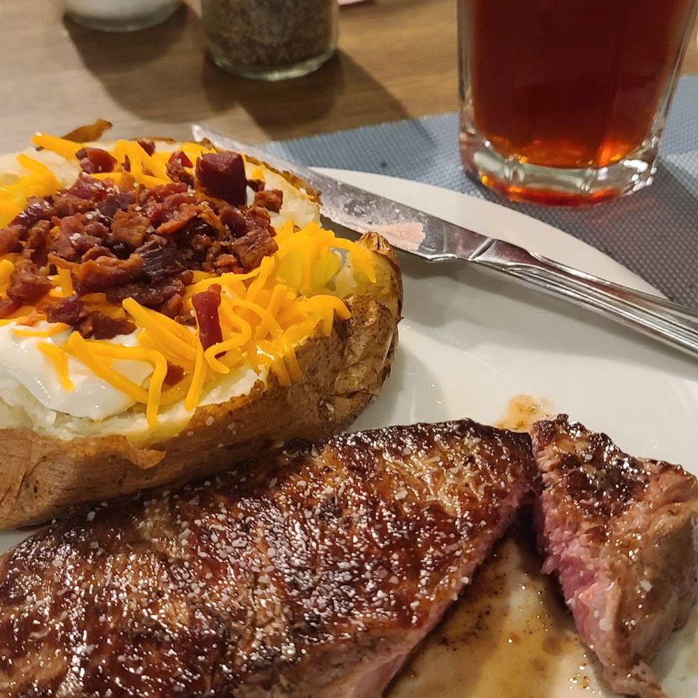 The Steakhouse - Strip and loaded baked potato - Steakhouses Near Me - La Junta, Colorado The Steakhouse - Strip and loaded baked potato - Steakhouses Near Me - La Junta, Colorado