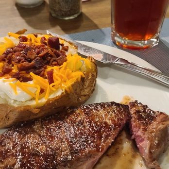 The Steakhouse - Strip and loaded baked potato - Steakhouses Near Me - La Junta, Colorado