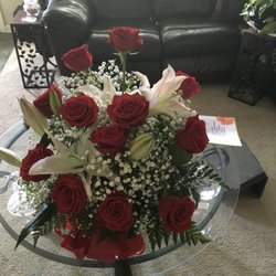 Odham's Flower Shop - Roses & Lillies with baby's breath adds a nice touch.