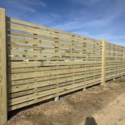 Magnolia Fence Company - Horizontal Wood Fencing around a Residential & Commercial Development
