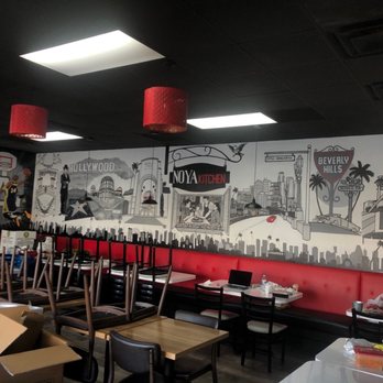 Noya Kitchen - Interior during COVID lockdown. Artwork showing the Bangladeshi diasporas amalgamation with SoCal and it's many well known milestones. - Indian Near Me - Los Angeles, California