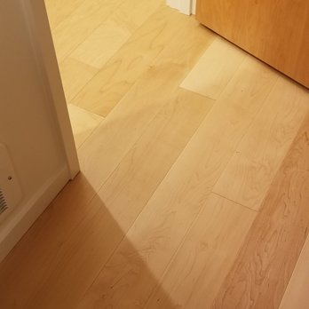 Modern Flooring Services - New flooring on the right. Older hallway flooring on the left. No transition into the room as we requested. - Flooring Near Me - Mukilteo, Washington Modern Flooring Services - New flooring on the right. Older hallway flooring on the left. No transition into the room as we requested. - Flooring Near Me - Mukilteo, Washington