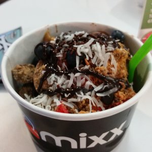 Photo of Mixx Frozen Yogurt - Allston, MA, United States. chocolate and vanilla yogurt, and just about everything unhealthy to put on top