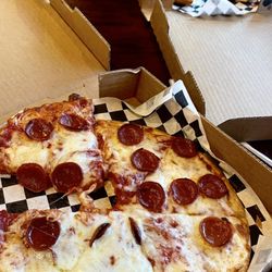 Dave's Pizza Garage - Front, pep pizza, chief chicken finger, back.