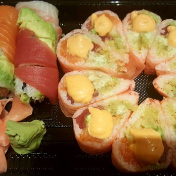 Sushi Cafe - Rainbow roll on the left...Hawaii roll on the right.  Both delicious! - Sushi Bars Near Me - Tampa, Florida