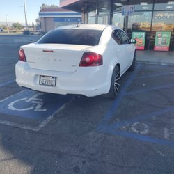 ampm - The a-hole that works there thinks it's okay to park in the handicap cuz he wants to watch his junk car !