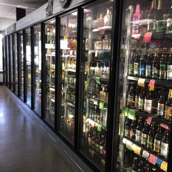 Woodcrest Liquor - a row of bottles of beer - Beer, Wine & Spirits Near Me - Riverside, California Woodcrest Liquor - a row of bottles of beer - Beer, Wine & Spirits Near Me - Riverside, California