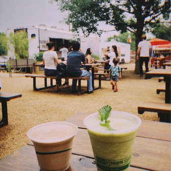 Pueblo Viejo Traila - View of the trailer from the seating area with drinks from Cosmic - Food Trucks Near Me - Austin, Texas