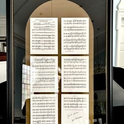 Framing Center - Handbell music, group photo and logo in church window design