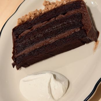 Super Peach - Chocolate Cake with chocolate buttercream frosting, a thin layer of marmalade, and whipped creme fraiche. Yummy! - Cocktail Bars Near Me - Los Angeles, California Super Peach - Chocolate Cake with chocolate buttercream frosting, a thin layer of marmalade, and whipped creme fraiche. Yummy! - Cocktail Bars Near Me - Los Angeles, California