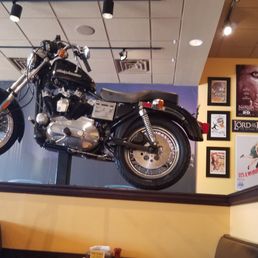 a motorcycle hanging from the ceiling a motorcycle hanging from the ceiling